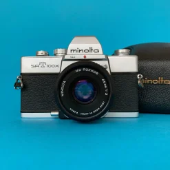 Minolta SRT100X 35mm SLR Film Camera w/ Prime Lens & Original Leather Case