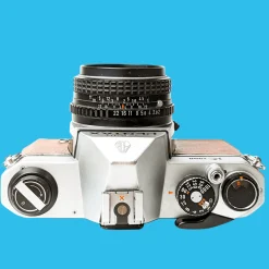 Pentax K1000 Brown Leather Vintage SLR 35mm Film Camera with Pentax f/2 50mm Prime Lens.