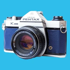 Pentax K1000 Navy Leather Vintage SLR 35mm Film Camera with Pentax f/2 50mm Prime Lens.