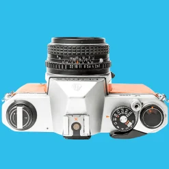 Pentax K1000 Orange Leather Vintage SLR 35mm Film Camera with Pentax f/2 50mm Prime Lens.