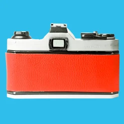 Pentax K1000 Red Leather Vintage SLR 35mm Film Camera with Pentax f/2 50mm Prime Lens.