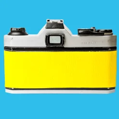 Pentax K1000 Yellow Leather Vintage SLR 35mm Film Camera with Pentax f/2 50mm Prime Lens.